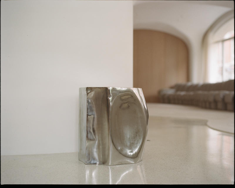 ROCHER SMALL TABLE IN POLISHED STAINLESS STEEL